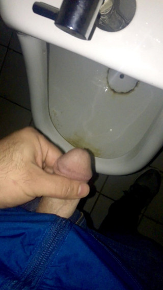 Brock pee in a public urinal.