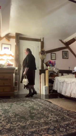 In an outfit with a little pleated dress for an evening