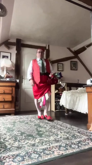 In outfit with a skirt and a red vest for a night out
