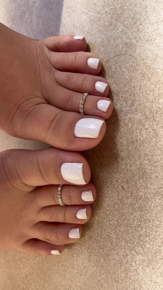 Perfect feet with little foot fetish ring and white nails