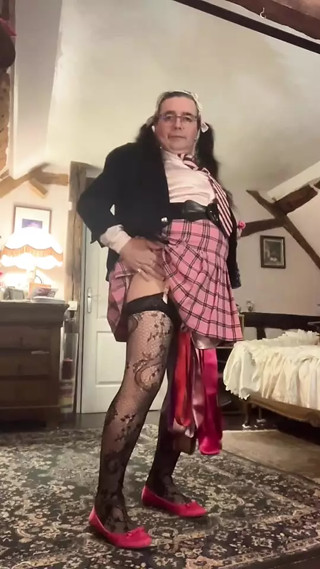 In a pink schoolgirl outfit for a night out