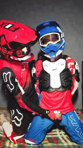 A guy in a motocross gear gets a portion on his mxhelmet