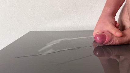 Huge cumshot on reflecting table after days of edging