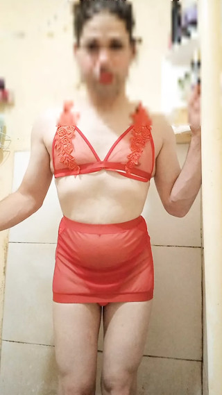 Boy wearing sexy red women's lingerie