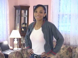Cute little black chick shows off her skinny beautiful bod on a couch
