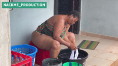 African Mama Multitasks on a Sunday Morning