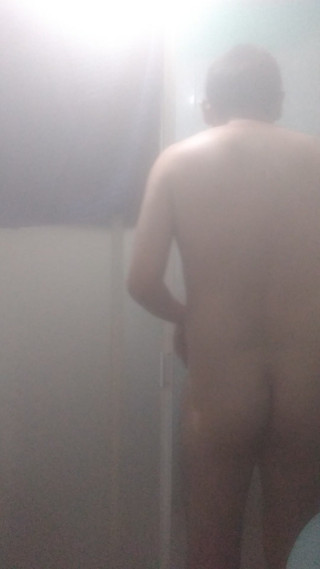 Naked man in shower