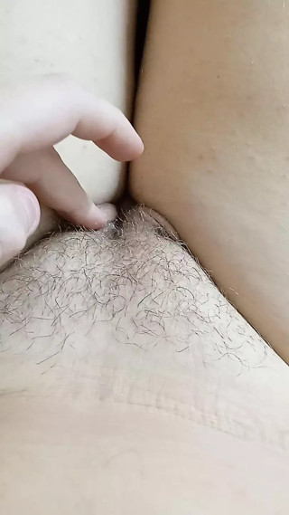 A young whore wets her fingers with saliva and caresses her pussy thumbnail