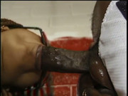 Lusty black bitch with glasses gets nailed by stud on the floor