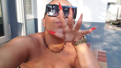 Sexy Latina teasing big titties outdoors
