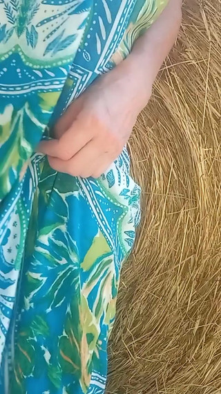 In the countryside: hay bale and red pussy