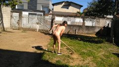 Housewife working naked in front yard while people was walking on street