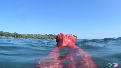 red stocking in the sea at the public beach
