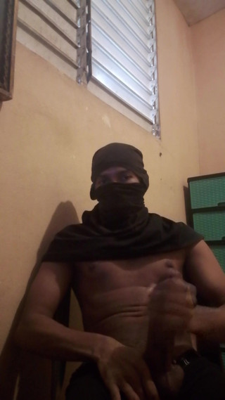 Masked big black cock masturbates