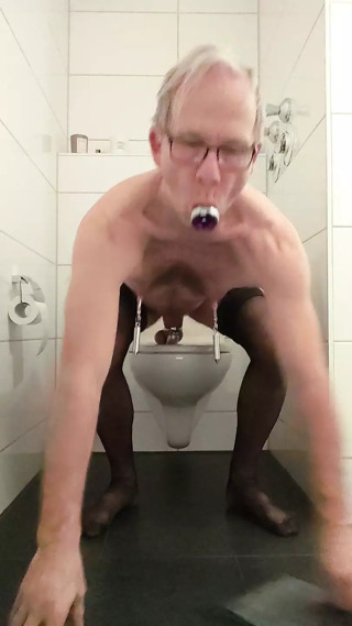 sharp nipple clamps on the toilet