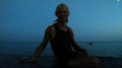 Alexa Cosmic swimming in the sea after sunset in clothes. Wetlook in sneakers, shorts and t-shirt
