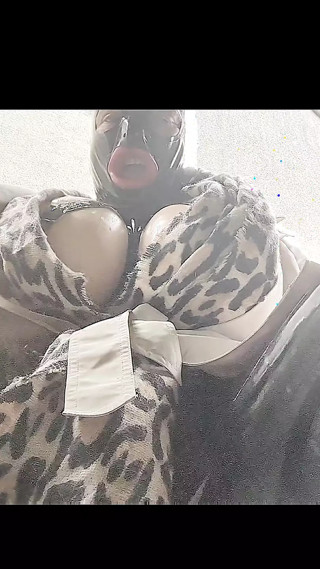 Alison outside in tight black rubber