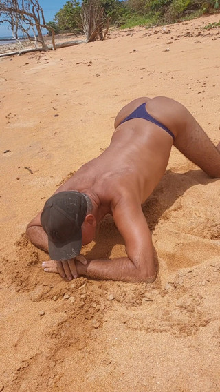 Ladysmith doing a striptease on the beach showing off her tanned ass with sexy mark thumbnail
