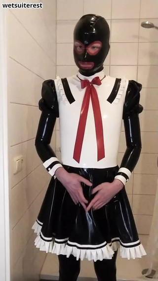 Latex maid uniform dress with black rubber skirt, red bow, frilly stockings and mask thumbnail