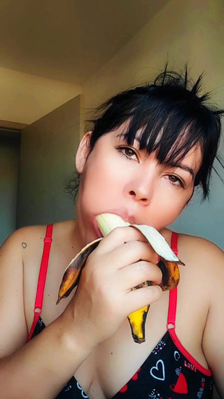 Young girl training blowjob on banana, deep throat