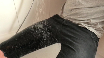 Wet black skinny ripped jeans in the shower