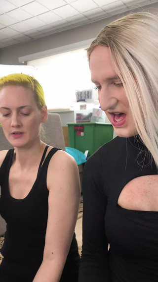 Drag Queen and Woman Putting on Foundation