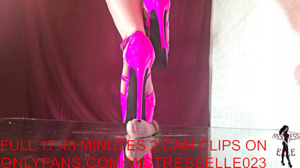 Mistress Elle tortures her slave's cock with her pink high heels