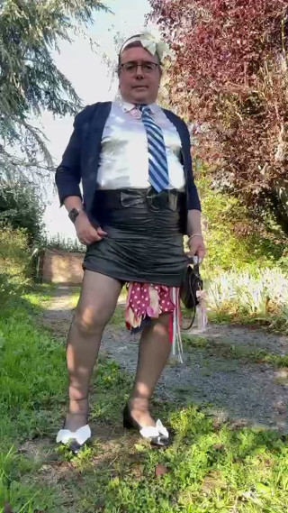 In a schoolgirl-style outfit with a short tight skirt for an evening
