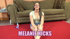 Melanie Hicks plays with her purple dildo