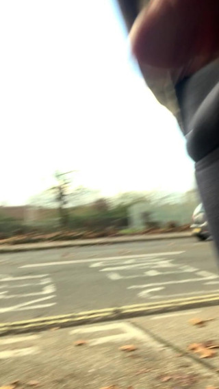 Walking on the street and showing Dick