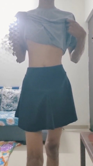 Skinny sissy boy masturbating in a skirt