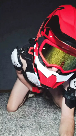 Naked boy in motocross gear and mxhelmet gets a strong orgasm