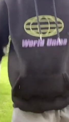 Young guy doing a back flip with a huge bulge in shorts
