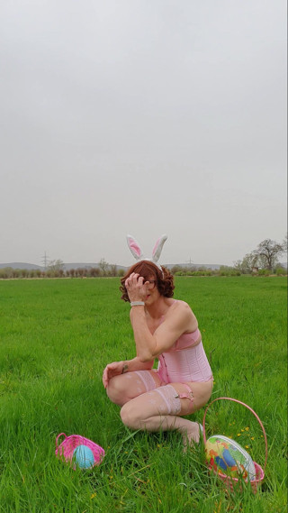 bunny alone with her balls in the green field thumbnail
