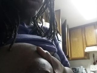 Ebony squeezes milk from her big black boob for Youtube