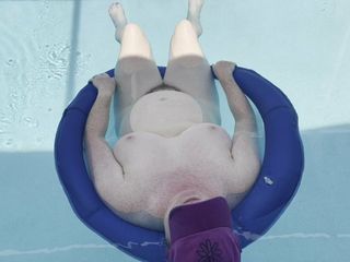 BBW floating naked in the pool