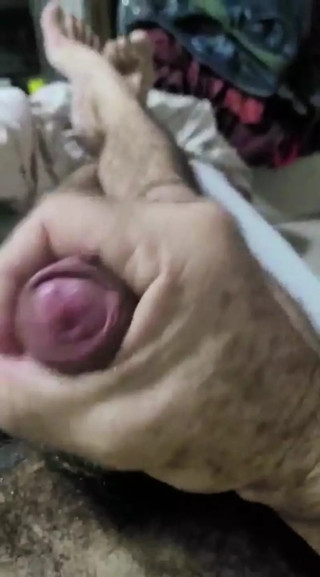 Hairy male cumming and playing with cock.