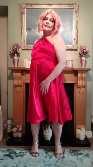 Sexy Crossdresser in Gorgeous Red Satin Dress thumbnail