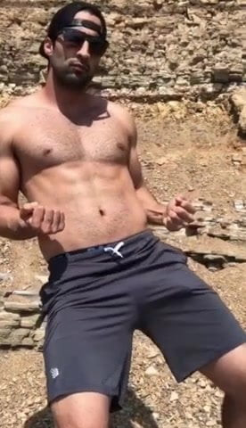 Sexy guy with huge bulge in shorts