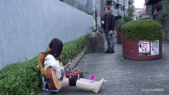 She was playing a guitar on the street and subsequently engaged in intense sexual activity