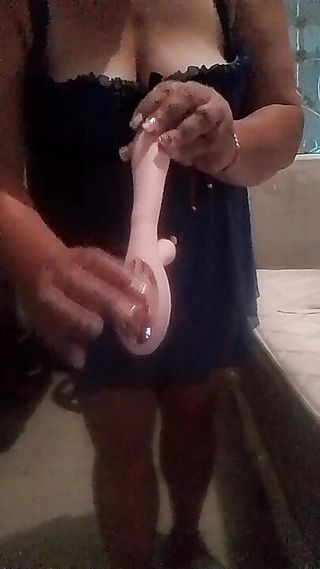 Dildo in the tight pussy of a perverted milf eager for cock