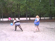 BBW gals play volley ball with balloons