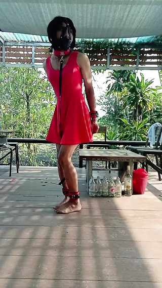 horny slave in front of the house thumbnail