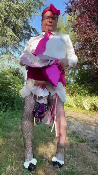 In little maid outfit with a short fuchsia skirt for a day