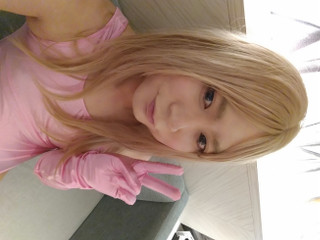 A blonde cross-dressing boy masturbated in a pink leotard, knee socks and gloves thumbnail