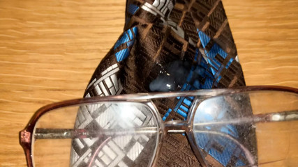 Cum on ugly glasses and ugly tie.