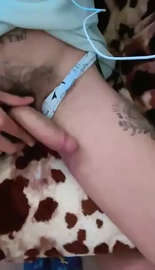 Tattooed twink playing with his member and playing with his precum