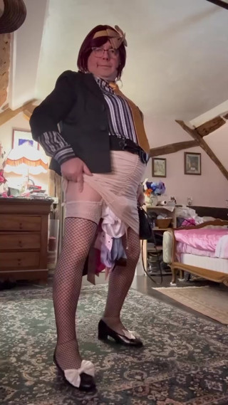 Dressed in a beige mini skirt for her evening thumbnail