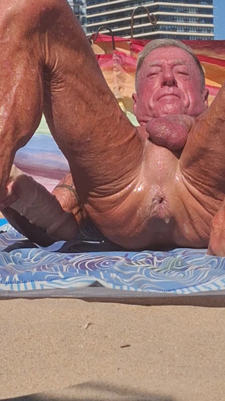 Key West oiled up using his new huge dildo at the beach
