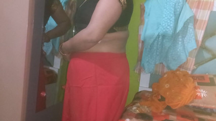 Indian housewife is wearing a yellow saree.